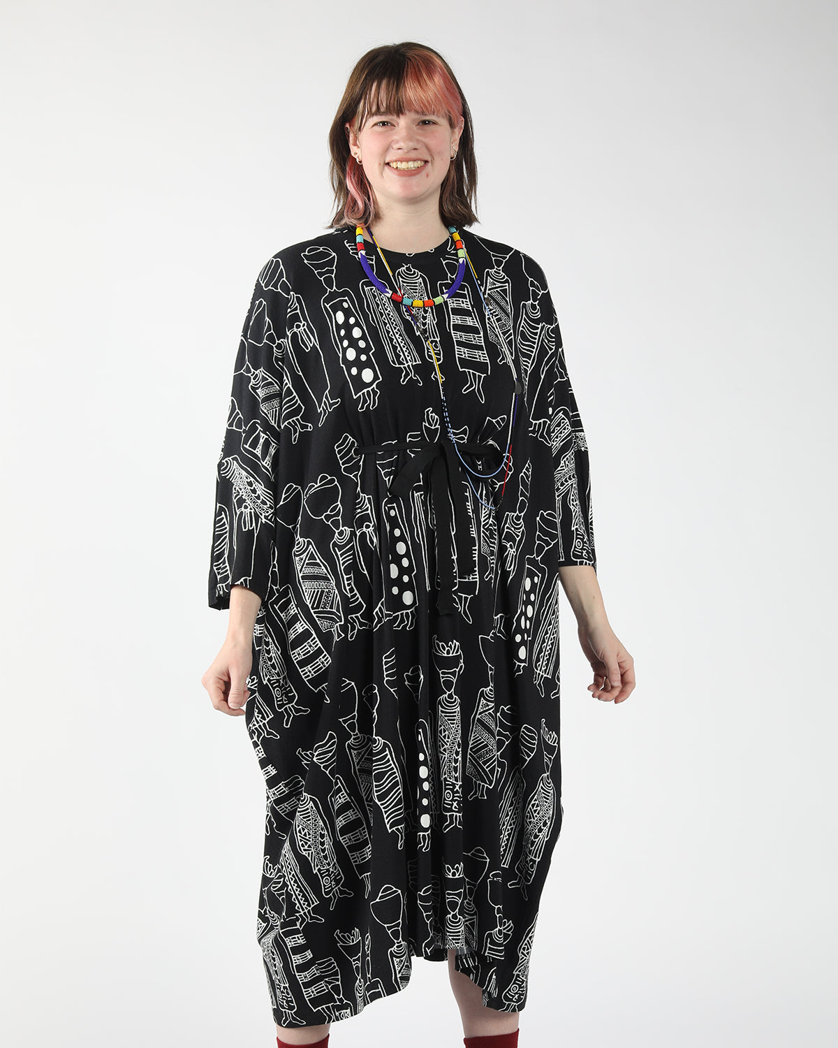 model wearing bold print confortable oversized  flattering dress