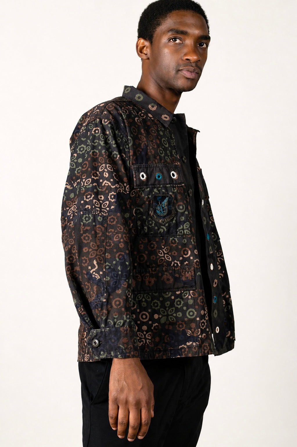 One-of-one vintage army jacket featuring tonal camouflage, natural iron dye process, and artisan mirror embroidery