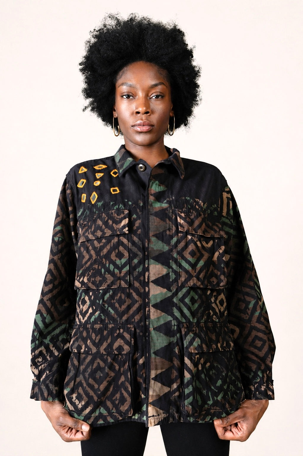 Exclusive reworked military jacket featuring earthy Natural dye (recycled iron + raw sugar), subtle geometric patterning, and artisan mirror embroidery