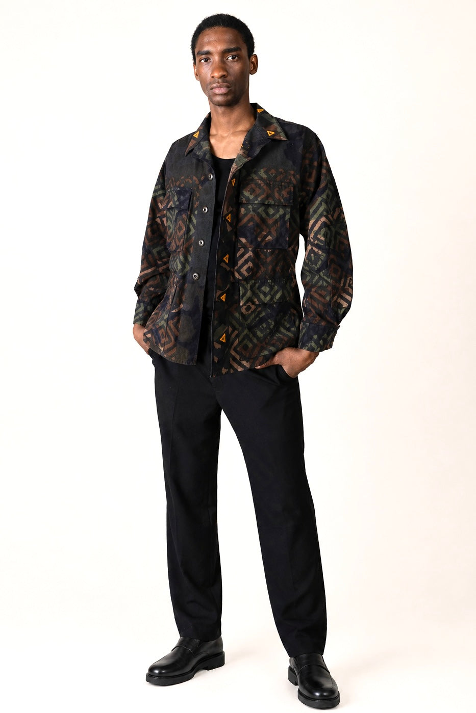 Exclusive reworked military jacket featuring earthy Natural dye (recycled iron + raw sugar), subtle geometric patterning, and artisan mirror embroidery